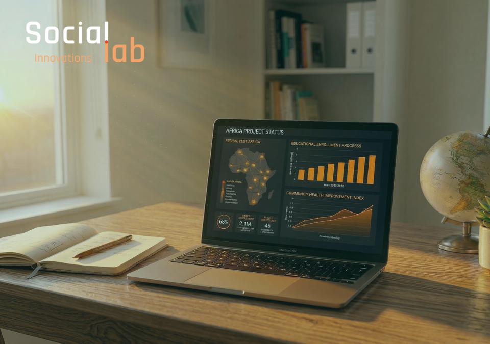 Data visualization dashboard on laptop showing Africa project growth in a human-centric workspace.