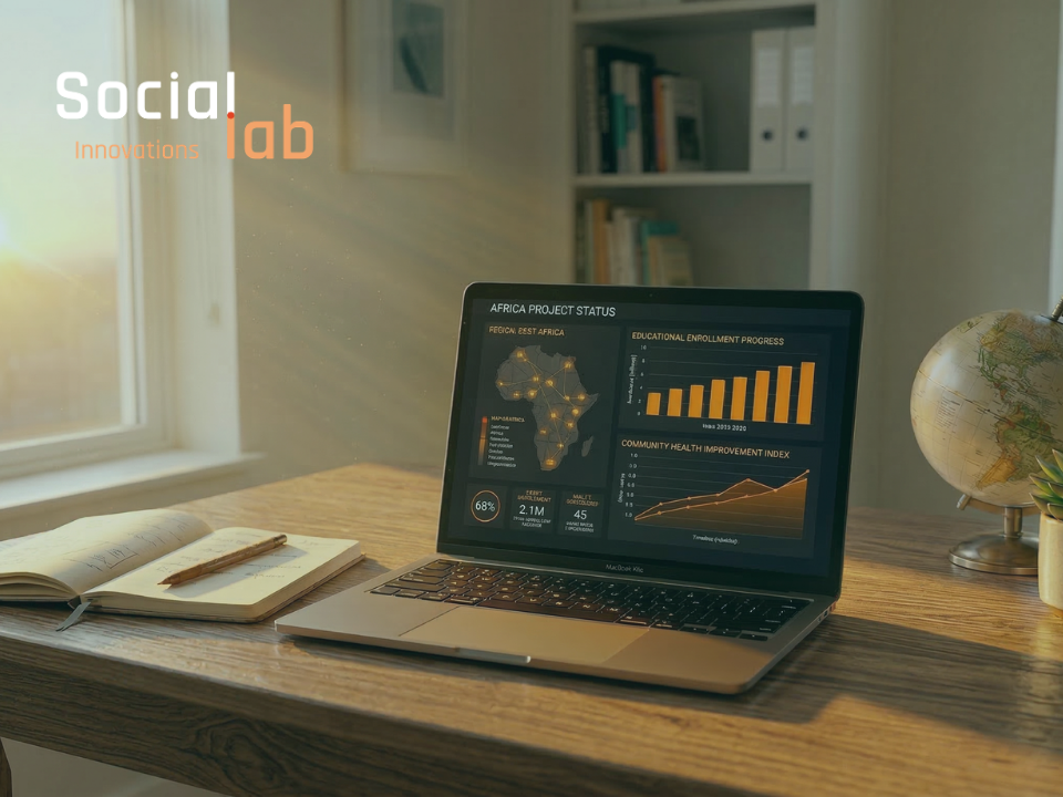 Data visualization dashboard on laptop showing Africa project growth in a human-centric workspace.