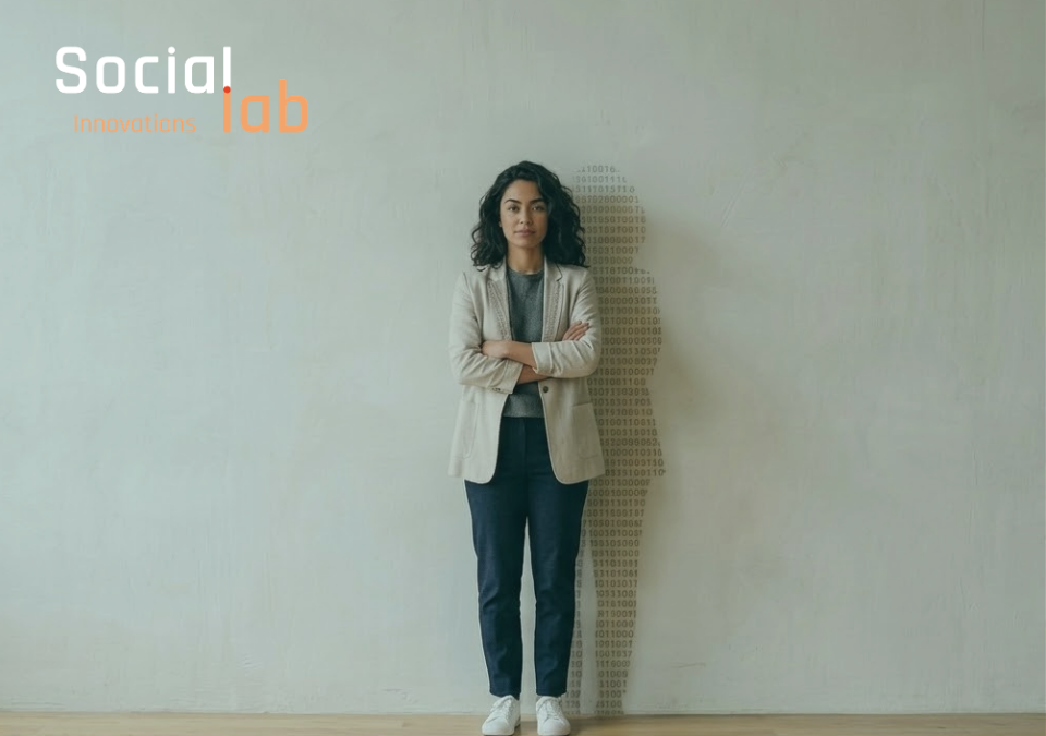A portrait of a confident woman standing against a plain wall with a shadow composed of binary code patterns, symbolizing women's empowerment and leadership in technology and AI development at SocialLab.