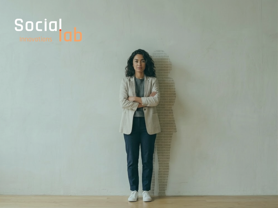A portrait of a confident woman standing against a plain wall with a shadow composed of binary code patterns, symbolizing women's empowerment and leadership in technology and AI development at SocialLab.