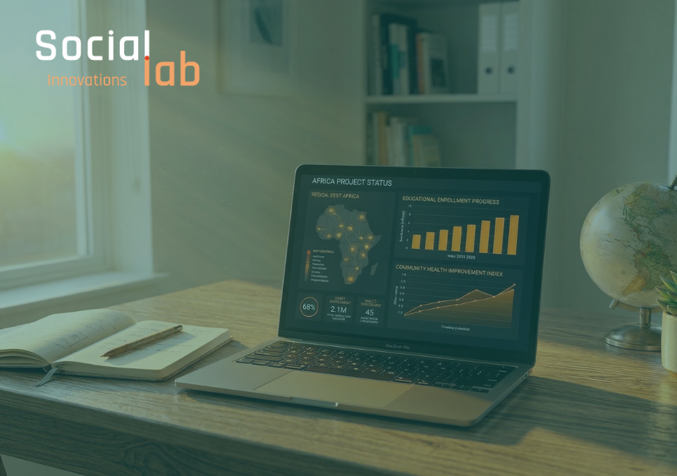 Data visualization dashboard on laptop showing Africa project growth in a human-centric workspace.