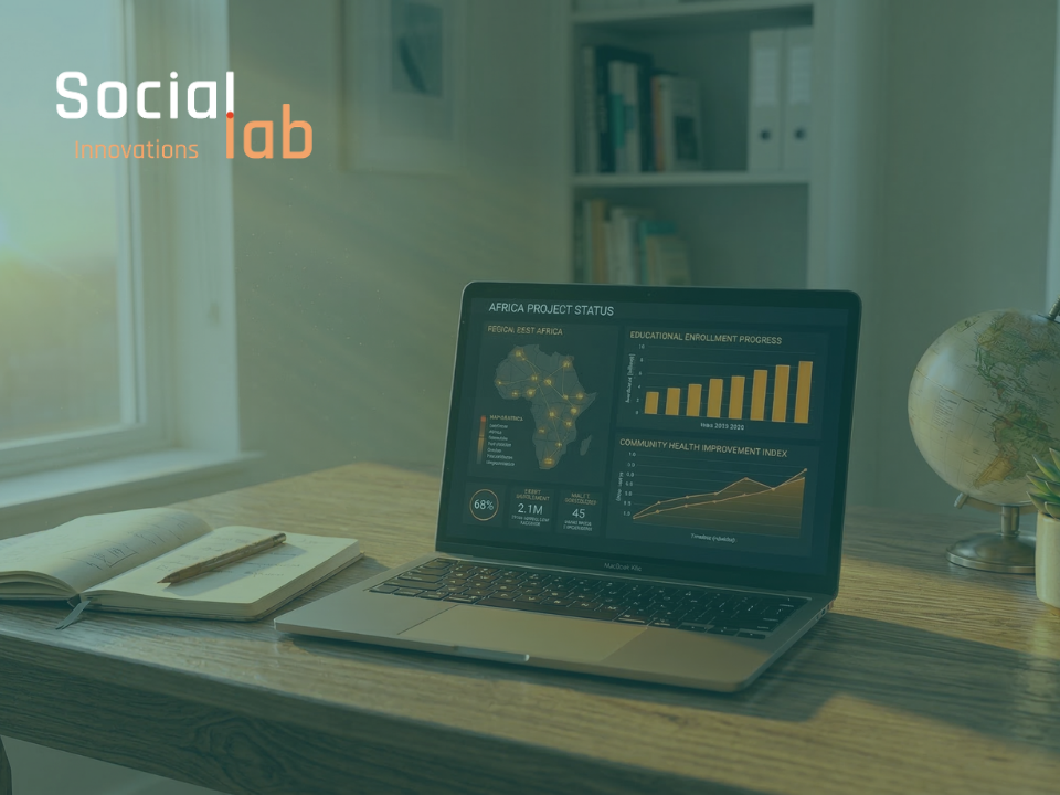 Data visualization dashboard on laptop showing Africa project growth in a human-centric workspace.