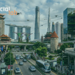 A high-angle photograph looking down a multi-level street in a futuristic and eclectic city that combines landmarks from diverse global locations, including the Marina Bay Sands-style complex and Gardens by the Bay with their supertrees, the twisting Shanghai Tower, and the soaring Burj Khalifa, with smaller architectural pieces like a medieval European-style tower, a traditional Asian pagoda, and an elevated automated transit line. Below, a busy roadway with electric buses and cars moves alongside a pedestrian area with small screens displaying maps, under a sky filled with drones.