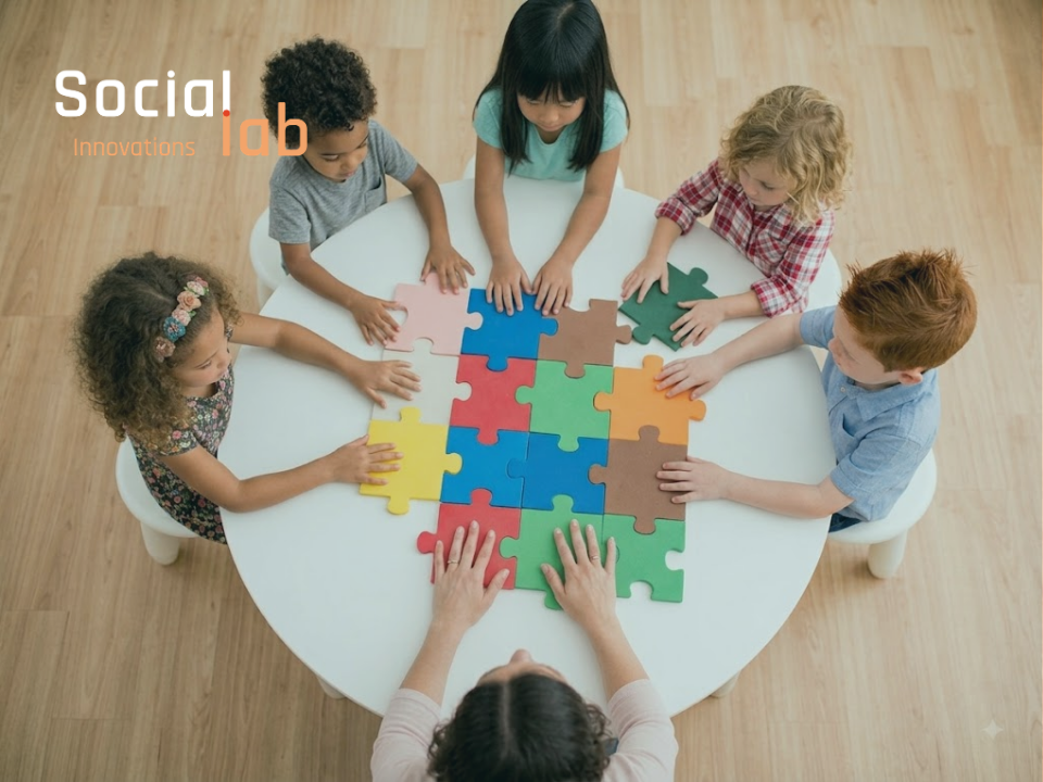 An overhead view of diverse children and an adult collaborating to piece together large, colorful puzzle blocks. This illustrates the collaborative, human-centric design approach for educational AI that is often missing from modern EdTech.
